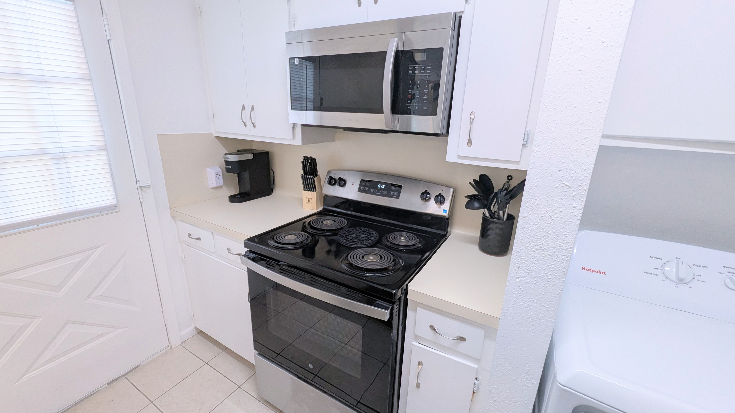 Equipped for all your cooking needs, the kitchen is fully stocked with dinnerware, pot & pans, baking pans, basic spices, and coffee bar. 