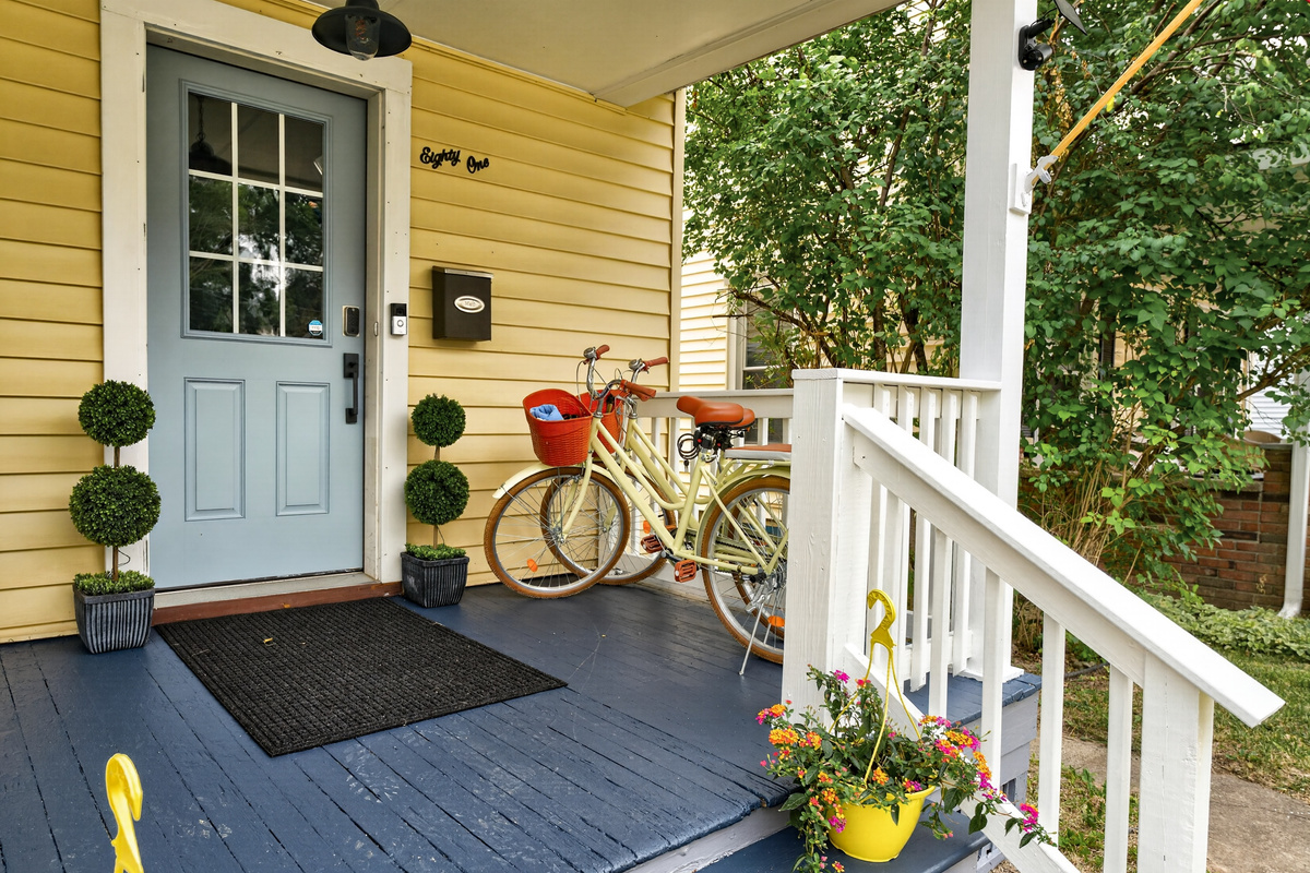 Front porch with bicycles by the entrance