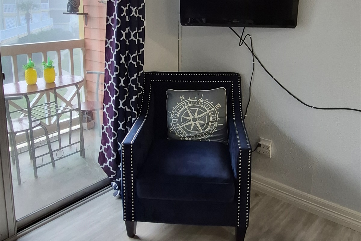 Directly across from the sofa you'll have a cozy "sittin" chair and the living room television