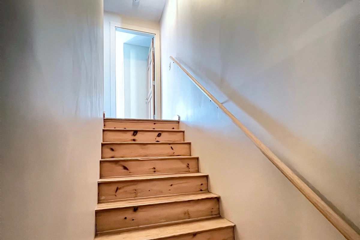 The interior staircase leads you to the quiet sleeping quarters on the second floor.