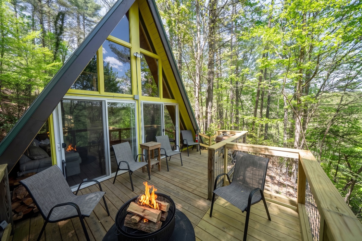 Step outside to relax on the deck, surrounded by trees and the peaceful sounds of nature.