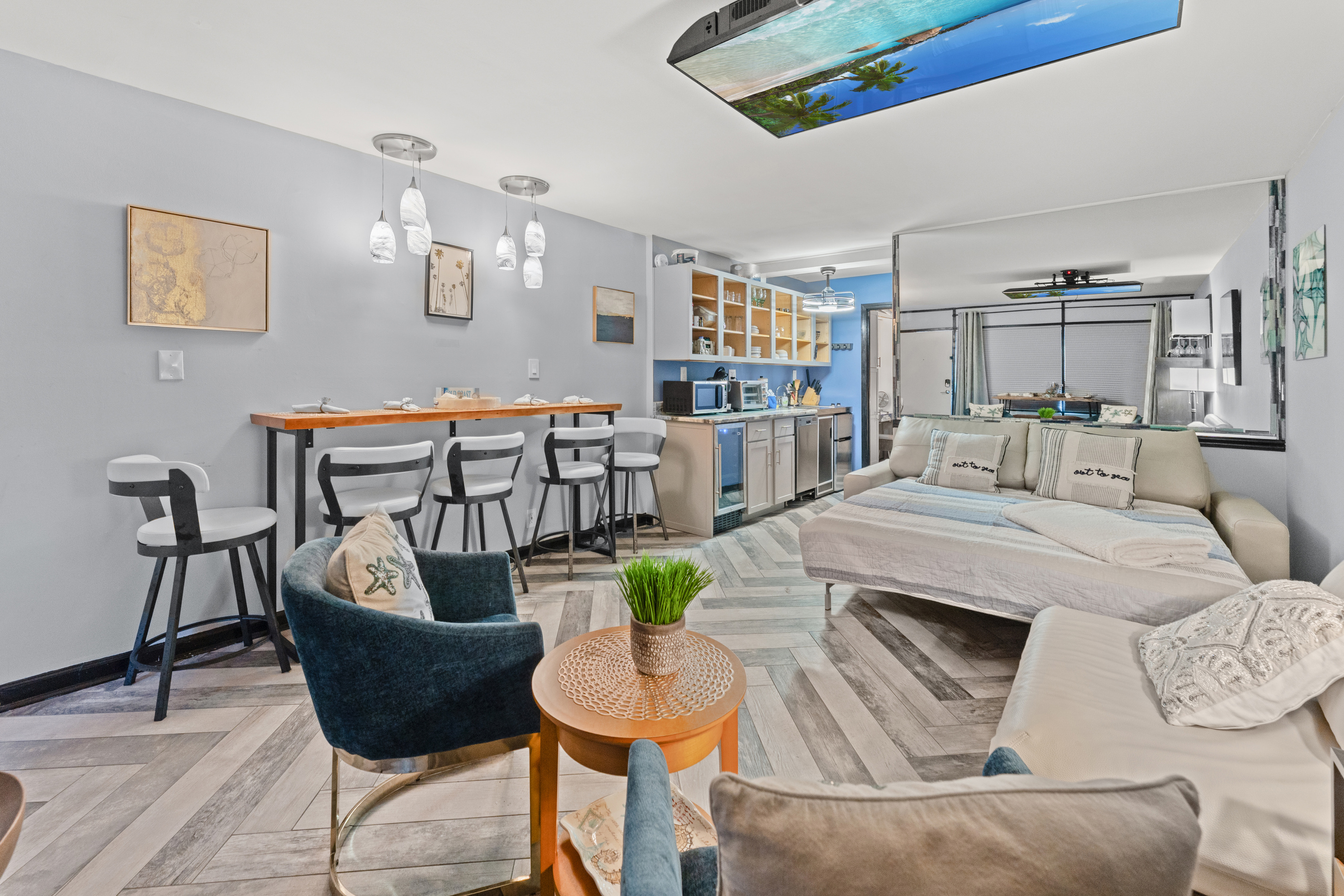 Plenty of seating with leather sofa, and occasional chairs, and bar top seating