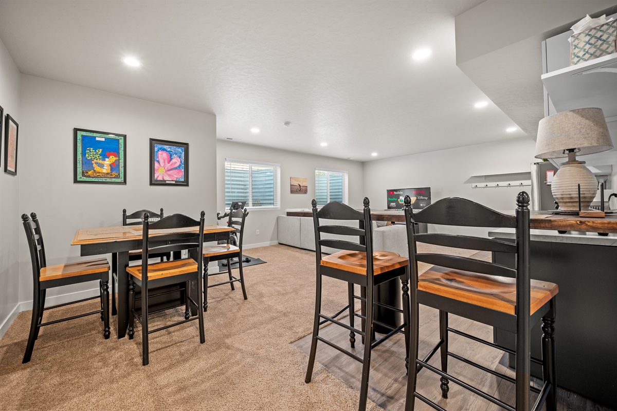 Bright and open, this lower-level floor plan brings together the kitchen, dining, and living areas to keep everyone connected.