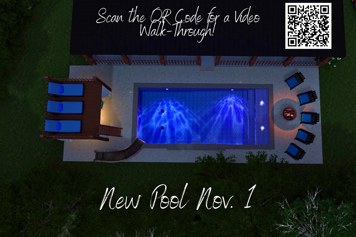 A bird’s-eye view of your new backyard oasis — complete with slide, firepit, and glowing waters. New pool Nov. 1!