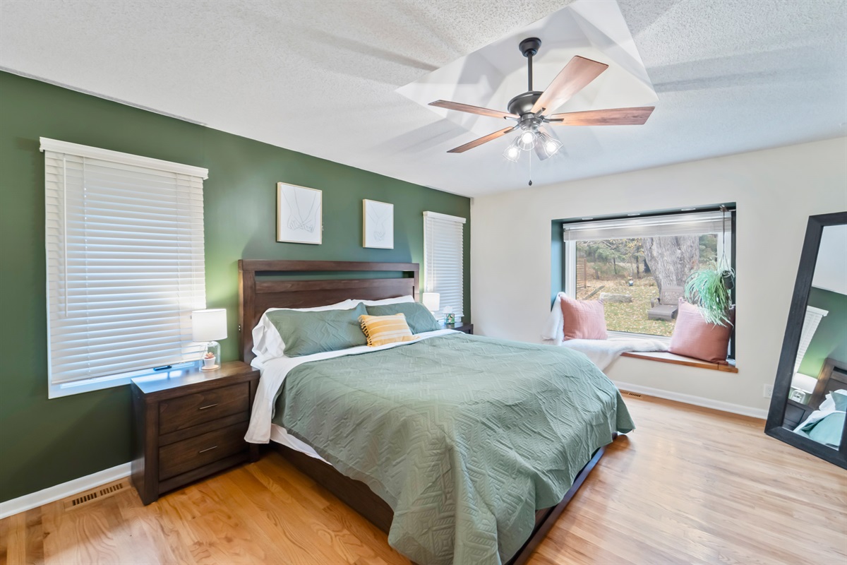The master bedroom has a large king sized bed with big comfy pillows to guarantee a good night's sleep.