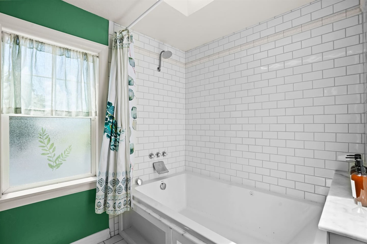 Main bathroom with a spacious bathtub
