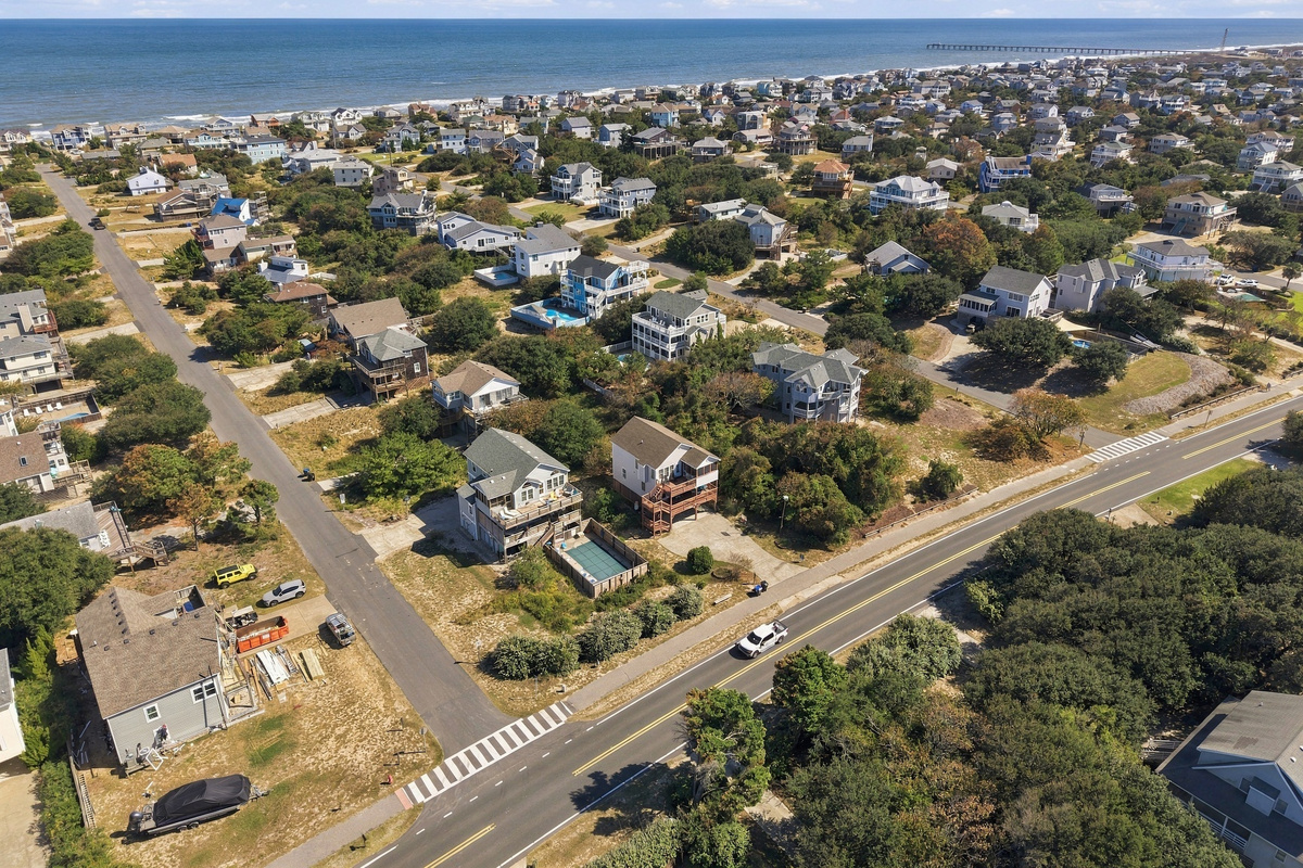 The Atlantic stretches out beyond the neighborhood, with the pier in the distance.
