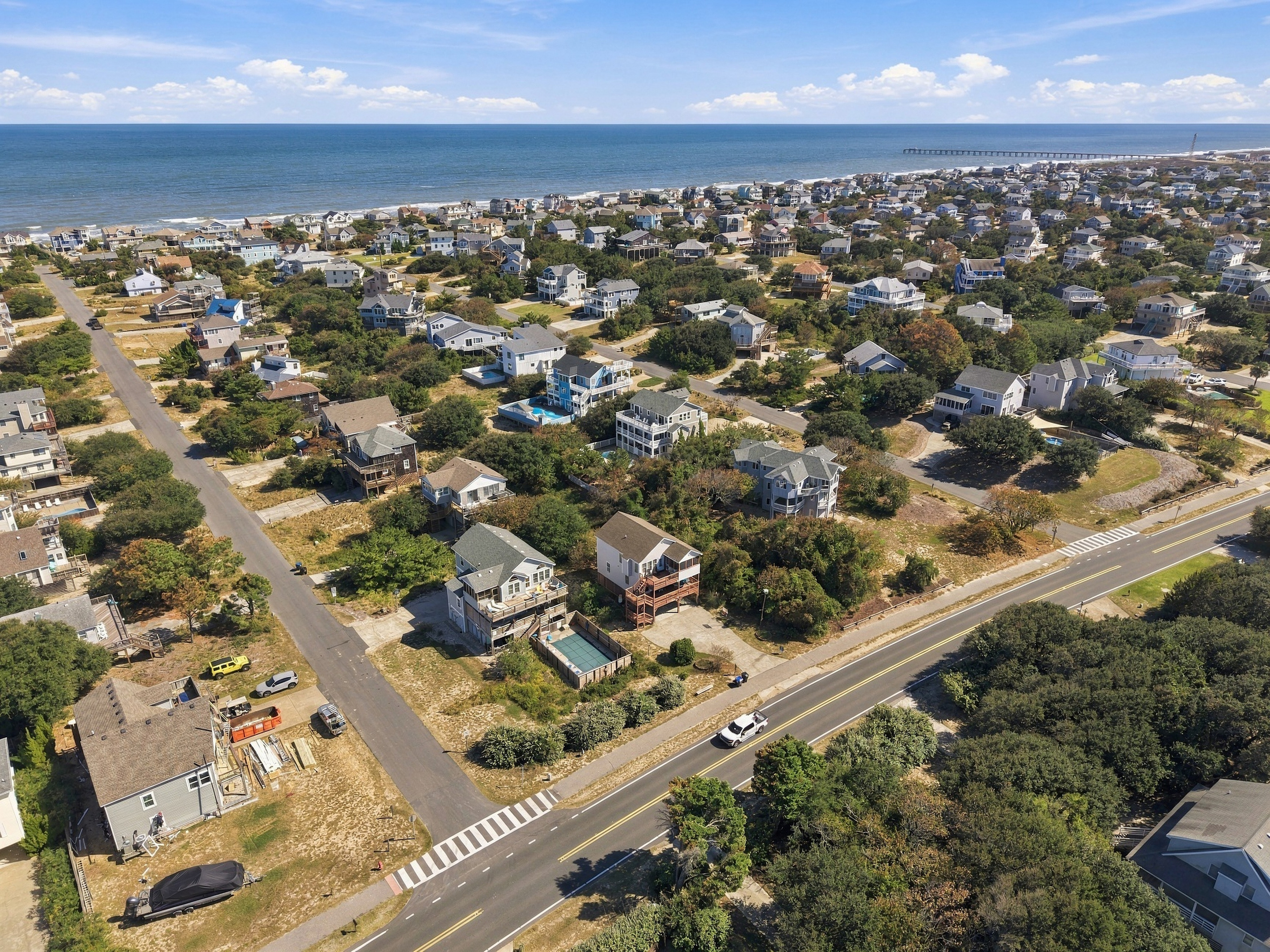 The Atlantic stretches out beyond the neighborhood, with the pier in the distance.