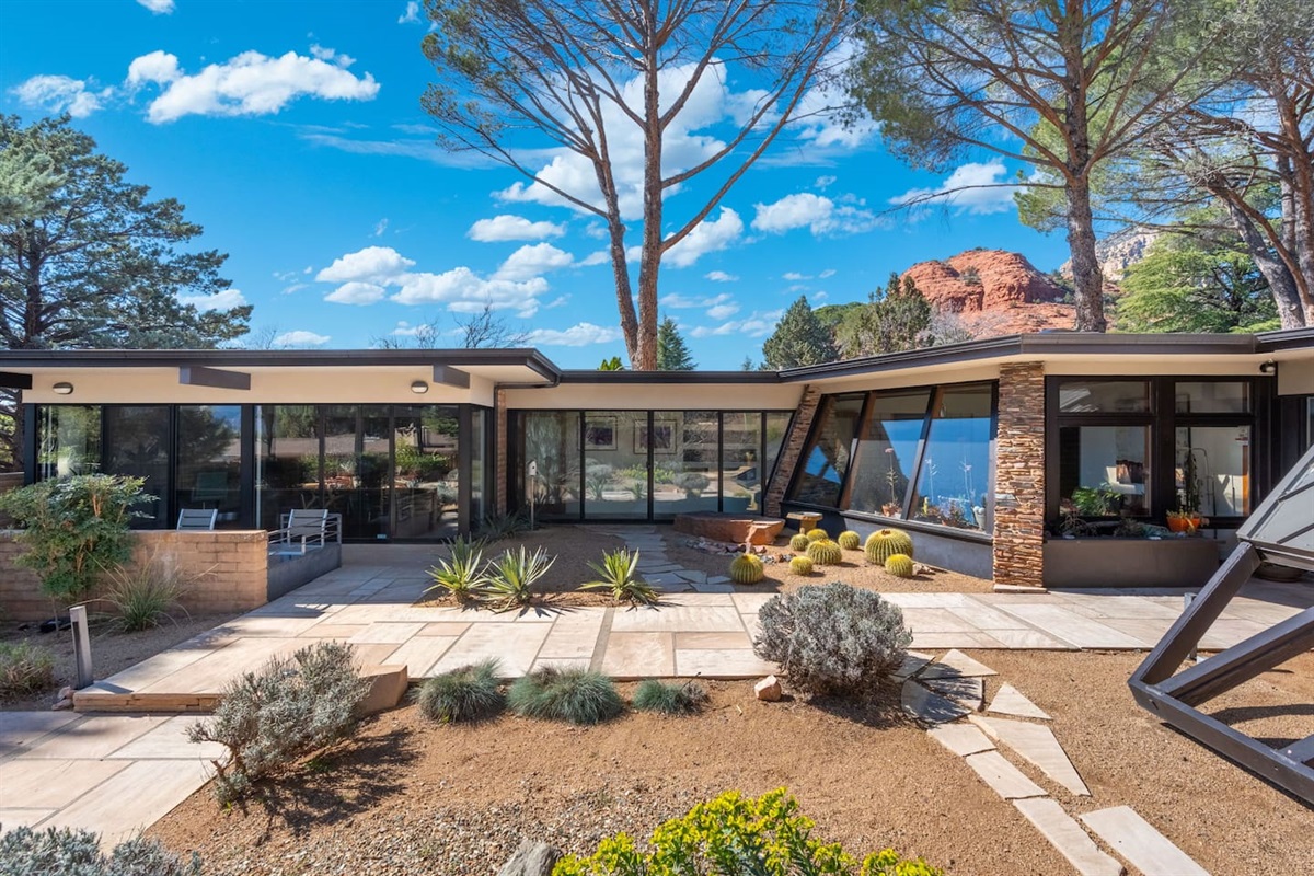 Floor-to-ceiling glass, bold mid-century angles, and serene desert landscaping set against Sedona’s iconic red rocks.