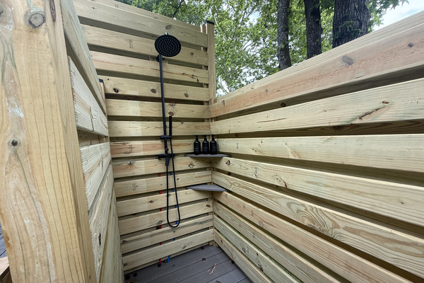 Private outdoor shower with hot and cold water — perfect for rinsing off after a day on the lake