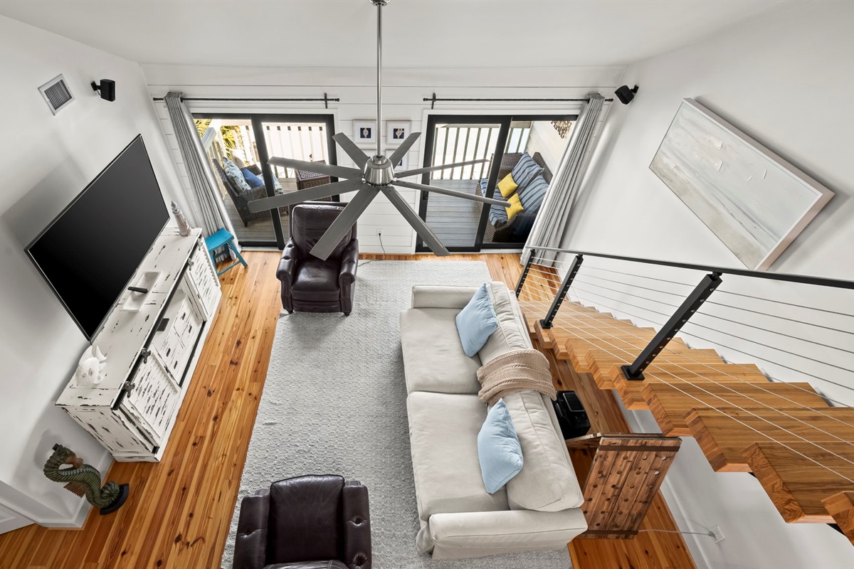 Gather in the spacious living room of our Cotton Bayou condo, complete with a smart TV, comfortable seating, and coastal-inspired decor. It's the perfect place to relax after a day by the pool or exploring the ba