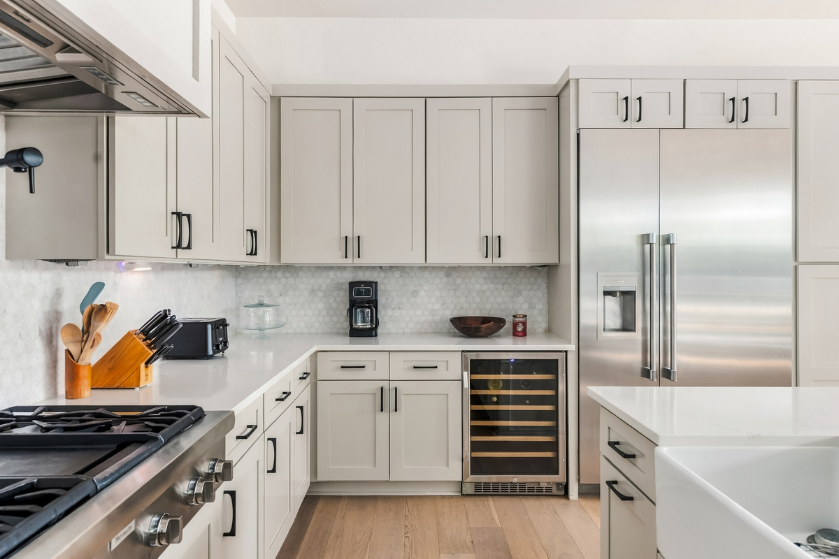 Stainless range and built-in wine fridge make this kitchen truly chef-ready.