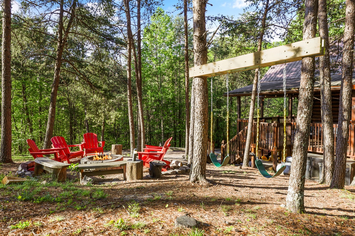 Outdoor space with a firepit, swings and plenty of space