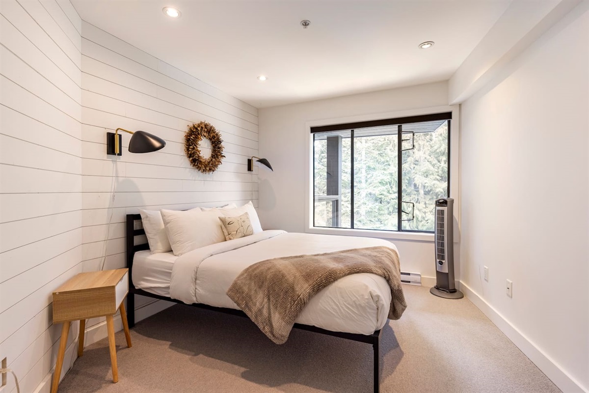 Queen bedroom on the main floor with the use of a full bathroom with tub/shower combo down the hall.