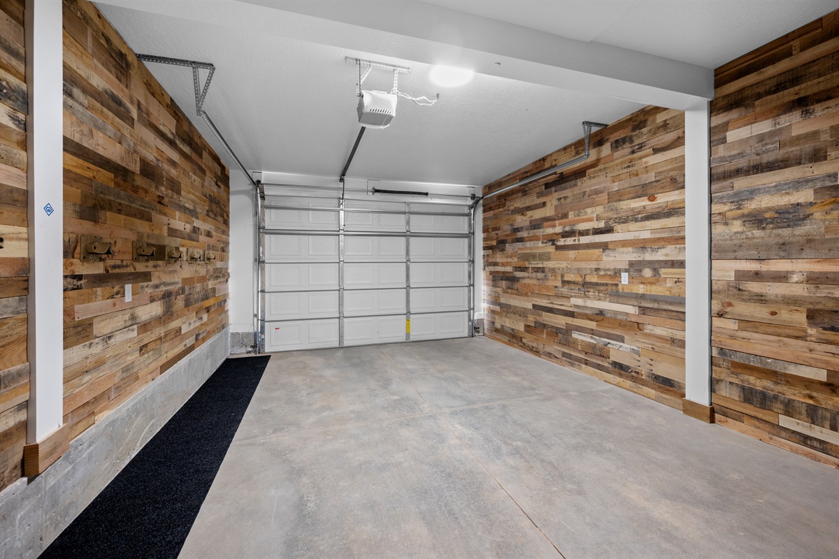 Private one-car garage with rustic wood paneling.