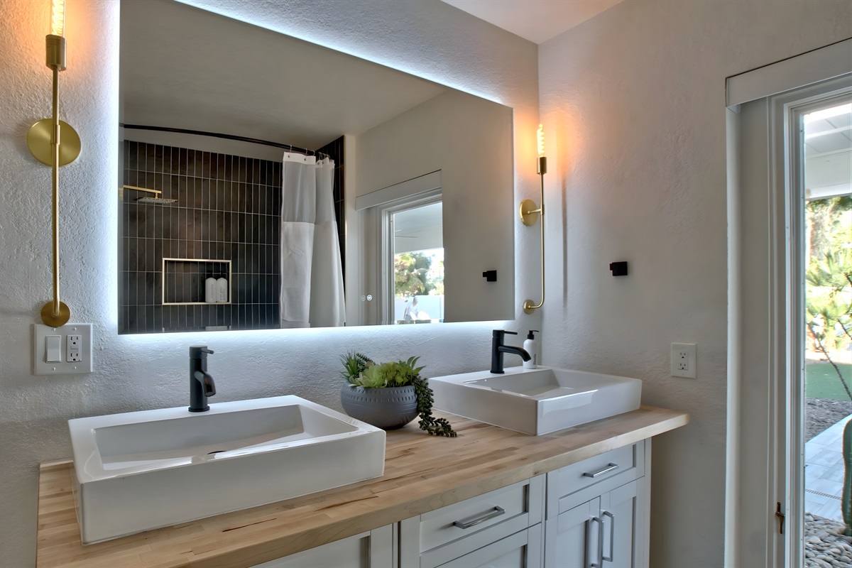 Primary bathroom with dual vessel sinks