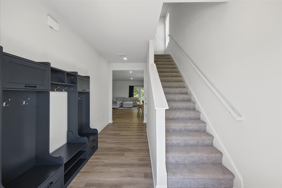Spacious entry with built-in bench and hooks so you can just drop your bags and settle in