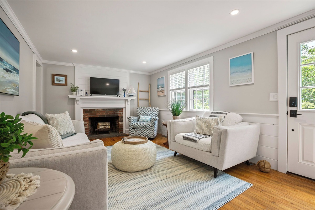 Chic, calming, and coastal—this living room is your perfect place to unwind between adventures.