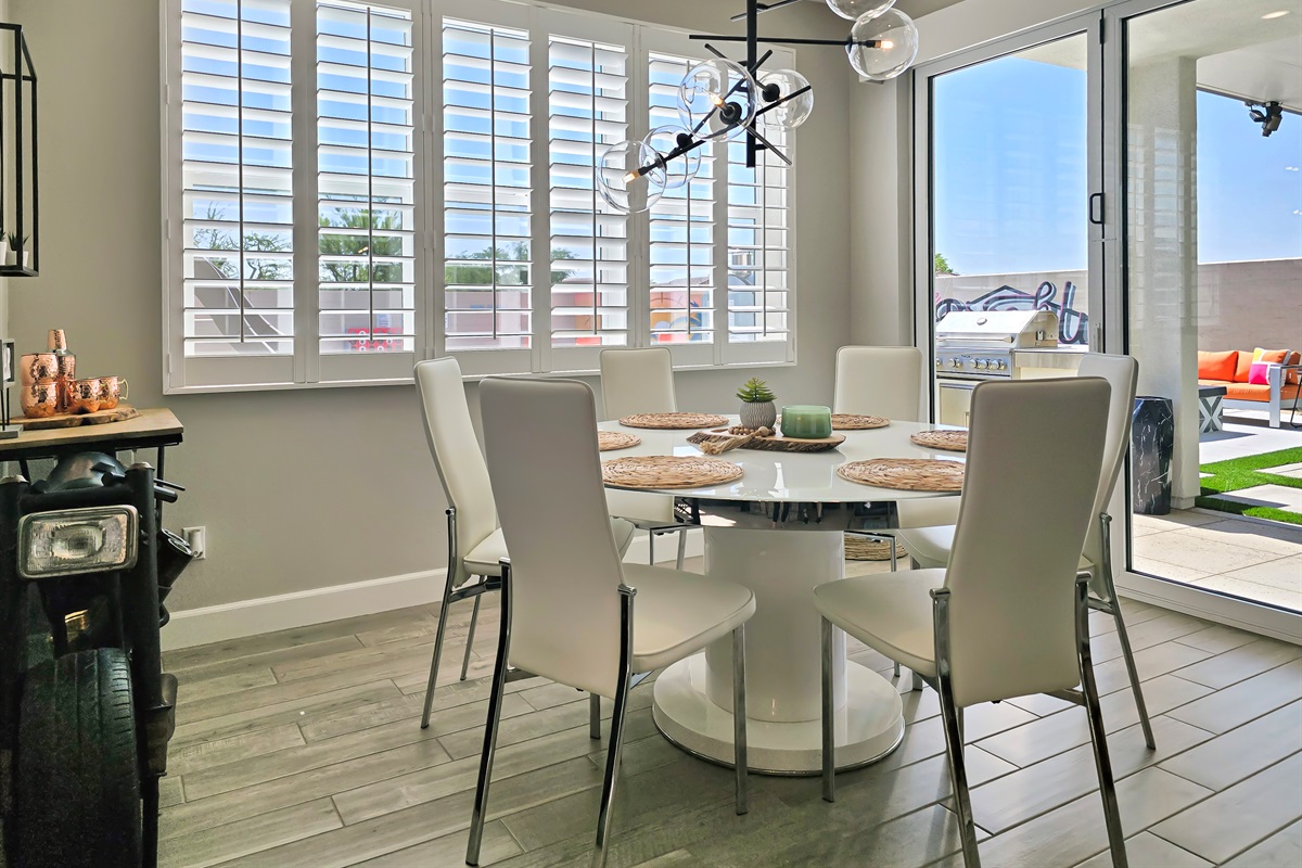 The dining room opens effortlessly to the backyard, creating a bright, sun-filled space perfect for indoor-outdoor living.