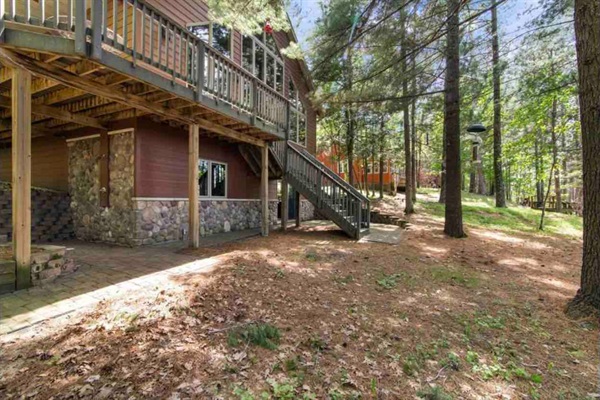 Wrap around deck with outdoor shower underneath 