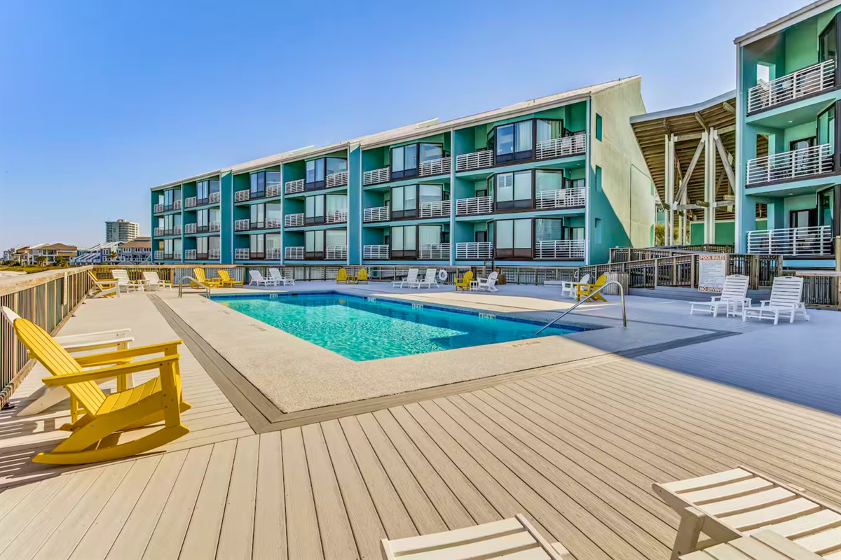 Take a refreshing dip in the pool, surrounded by plenty of seating for a laid-back afternoon.