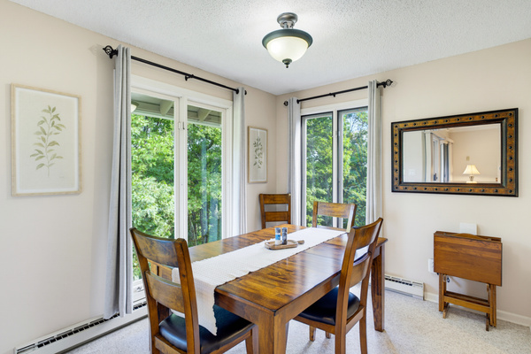 Enjoy meals surrounded by treetop views in the light-filled dining room.
