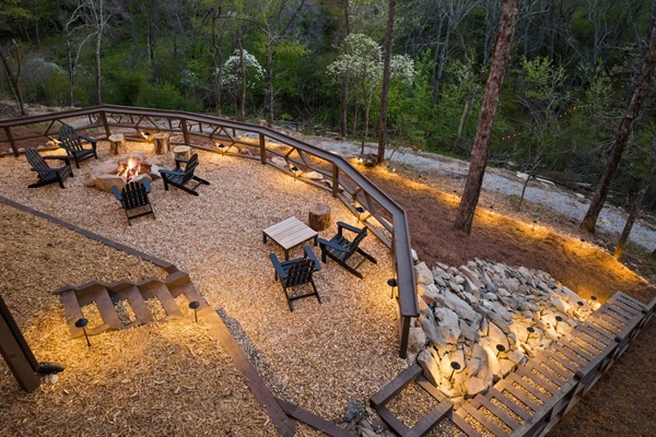 Hang out and take in the breathtaking views on the fire pit patio. The two chairs have long range mountain views and there is ample seating for the entire group at the fire pit! The railing is designed to hold drinks. S'mores are calling!