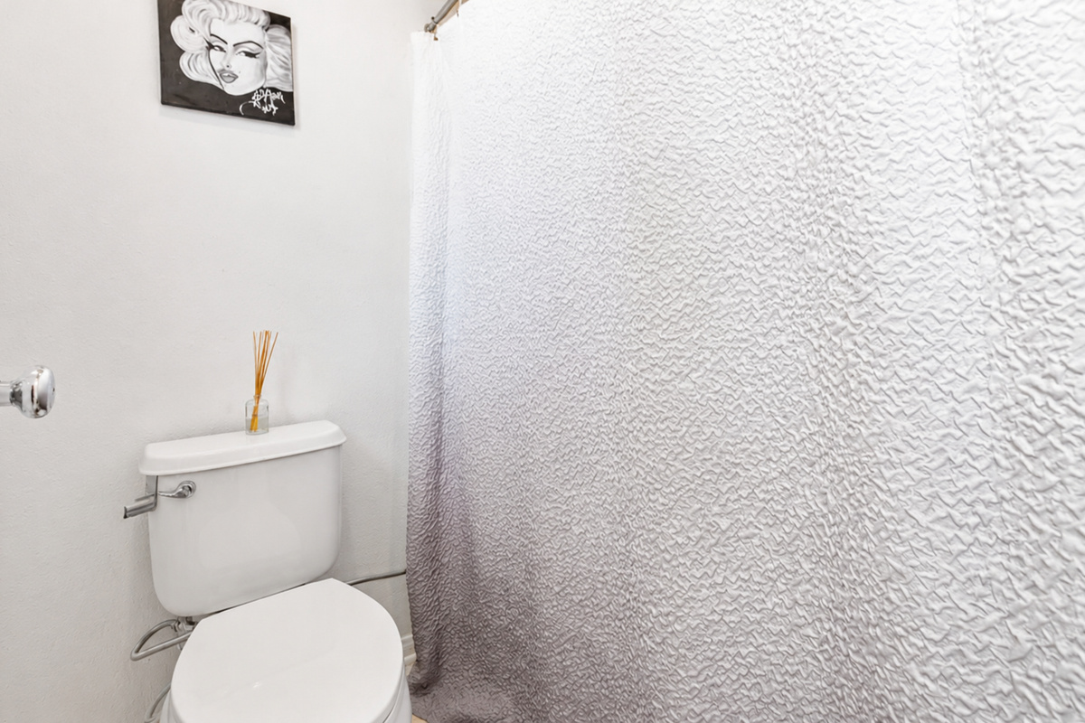 Small bathroom with a shower, simple essentials, and a clean setup for daily use.