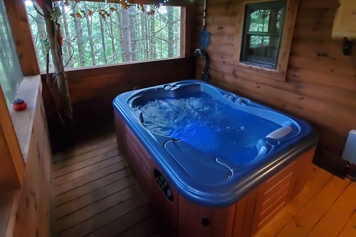 Enjoy the screened-in deck with a hot tub.