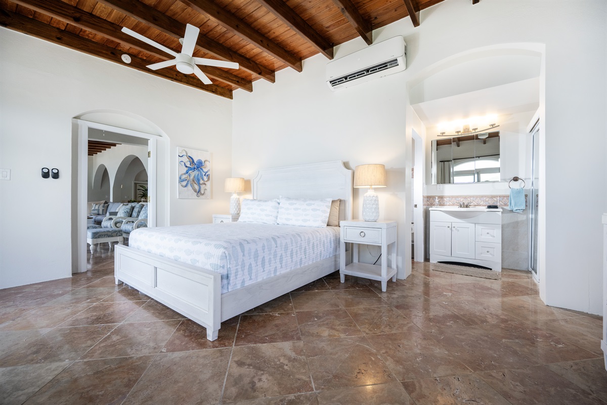 Main Floor Guest Bedroom: Relax in style with sweeping views of Hull Bay from every angle.