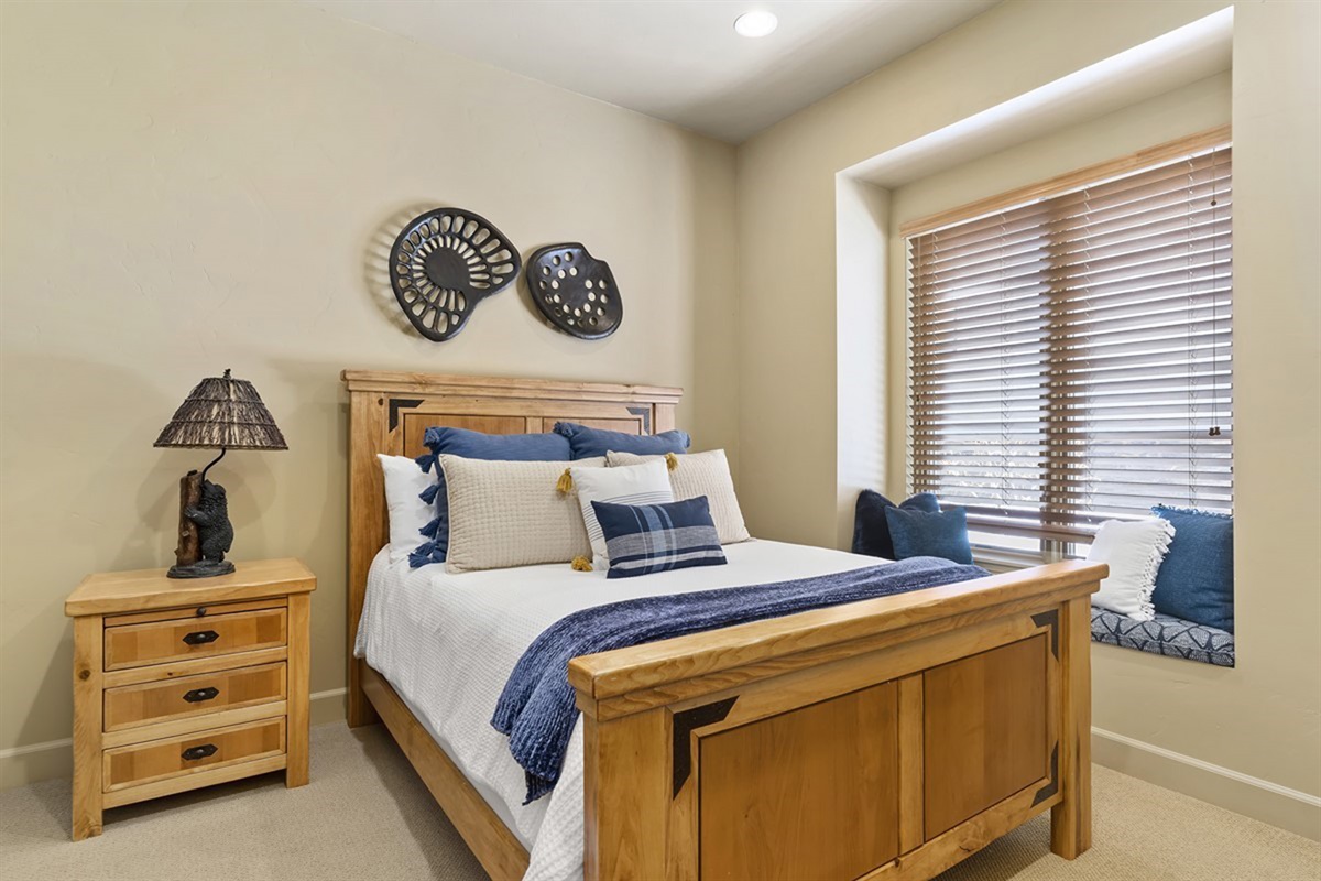 Cozy guest bedroom with inviting textures and a peaceful, relaxing feel.