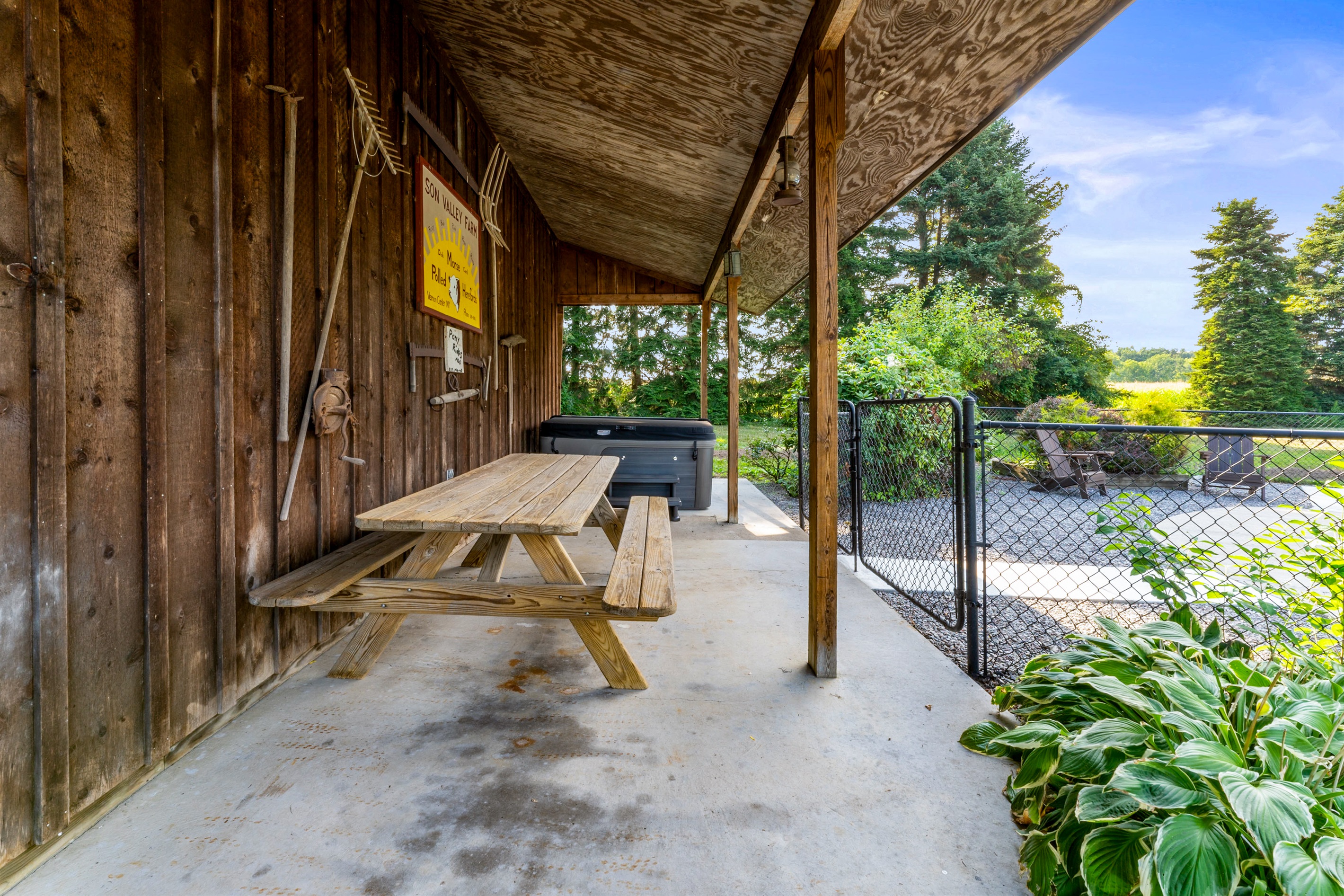 Gather with friends and family at the covered picnic table, just steps from the relaxing hot tub and pool.