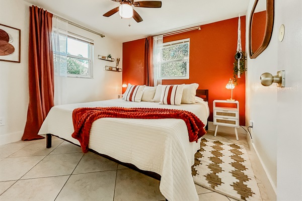 Master Bedroom with King Size Bed, Night Stands, Lamps/charging ports, Local Artist Mural, 4 King Sized Pillows, Mirror, Table Top Fan for White Noise, Iron, Ironing Board, Luggage Rack & More