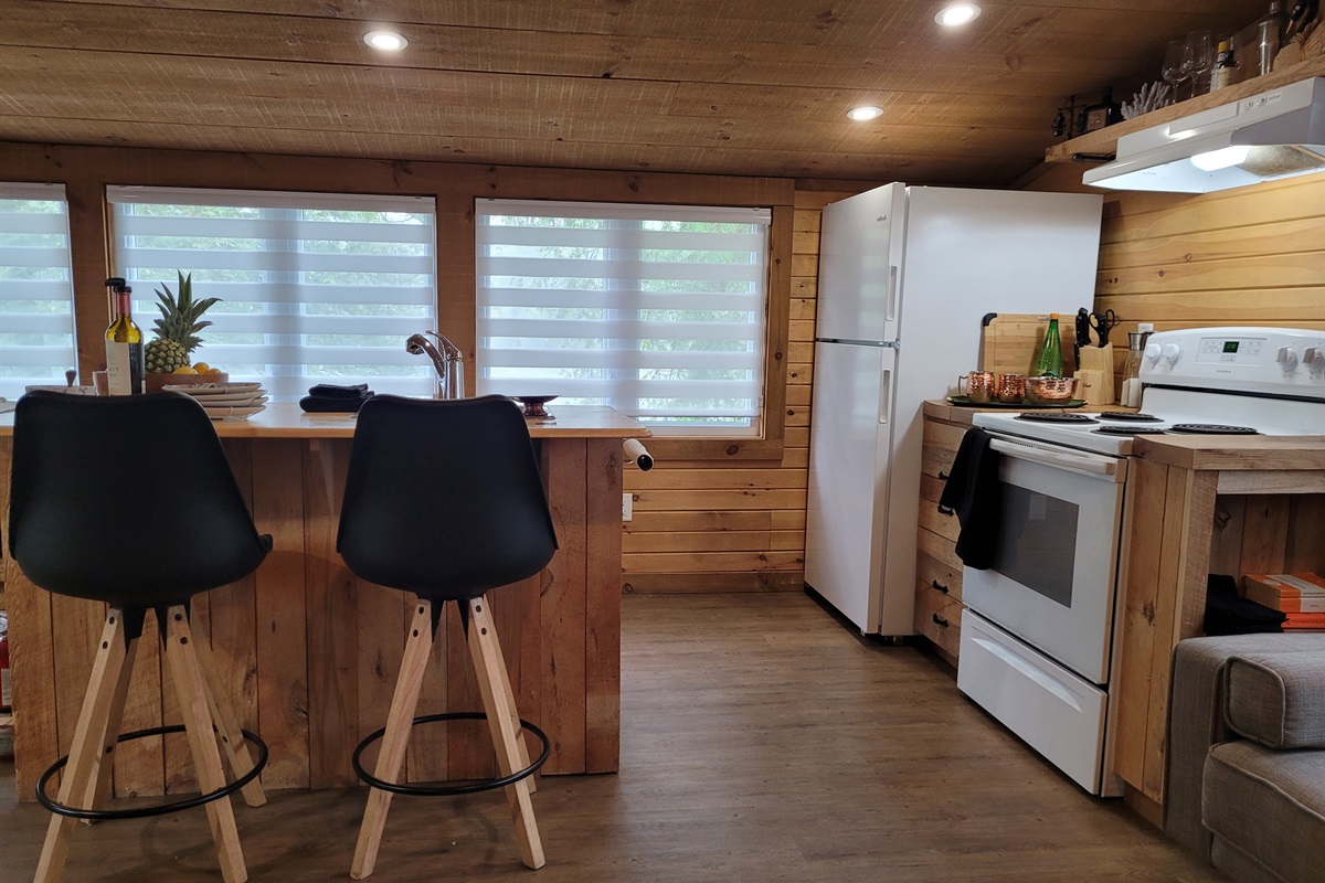 Kitchen area with major appliances and kitchen island