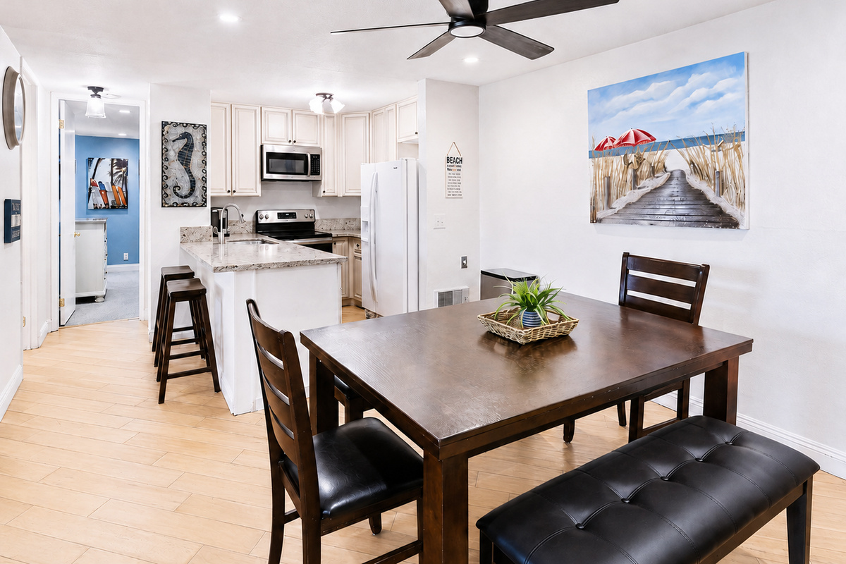 Kitchen and dining for six with stainless-steel appliances and Keurig coffee maker
