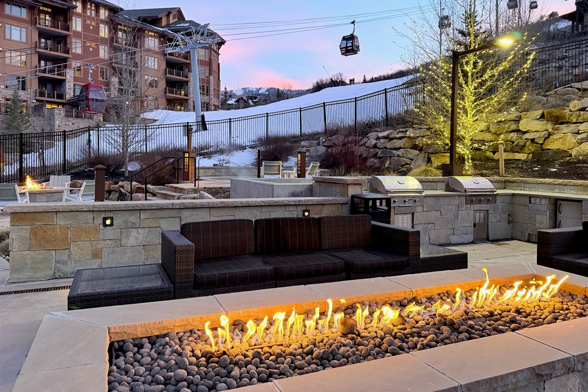 firepits and grills overlooking ski run and gondola