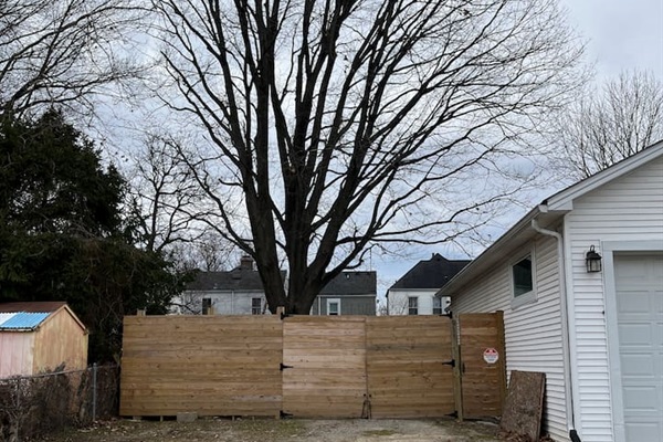 Parking area in the back for guests. Use the far right door on the right to walk into back yard to house. 