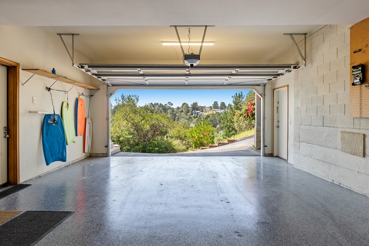 Spacious garage with an EV charger for modern convenience.