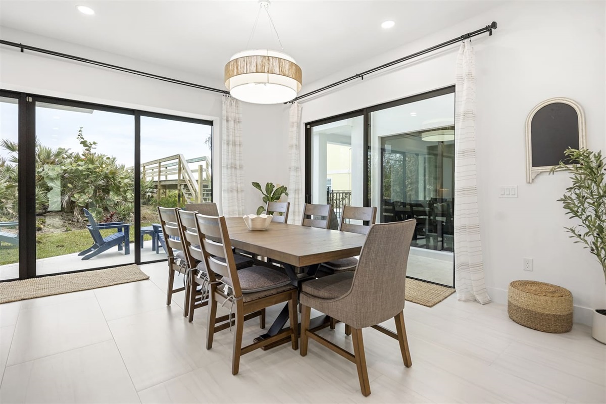 Our large dining table comfortably seats 8, ideal for family meals or group gatherings.