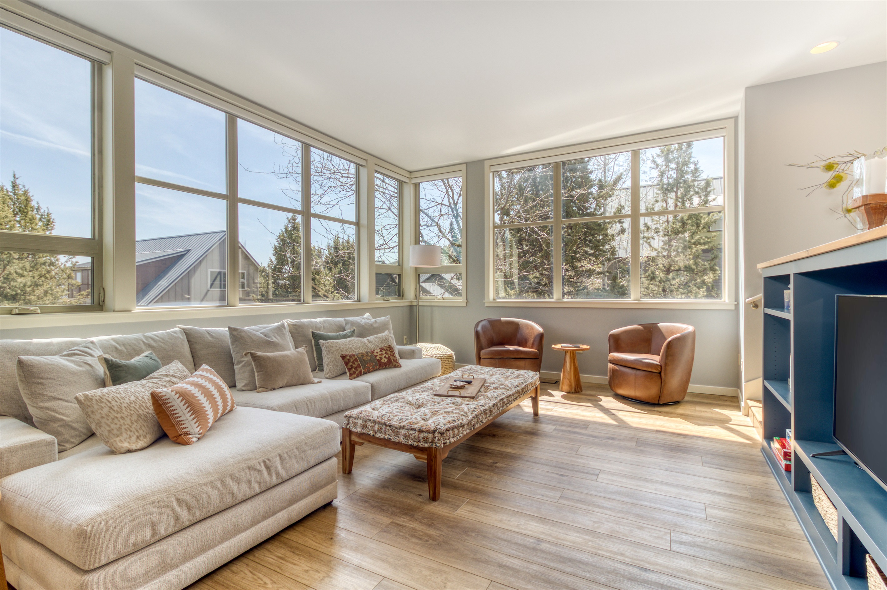 Open concept layout with plush seating and natural light