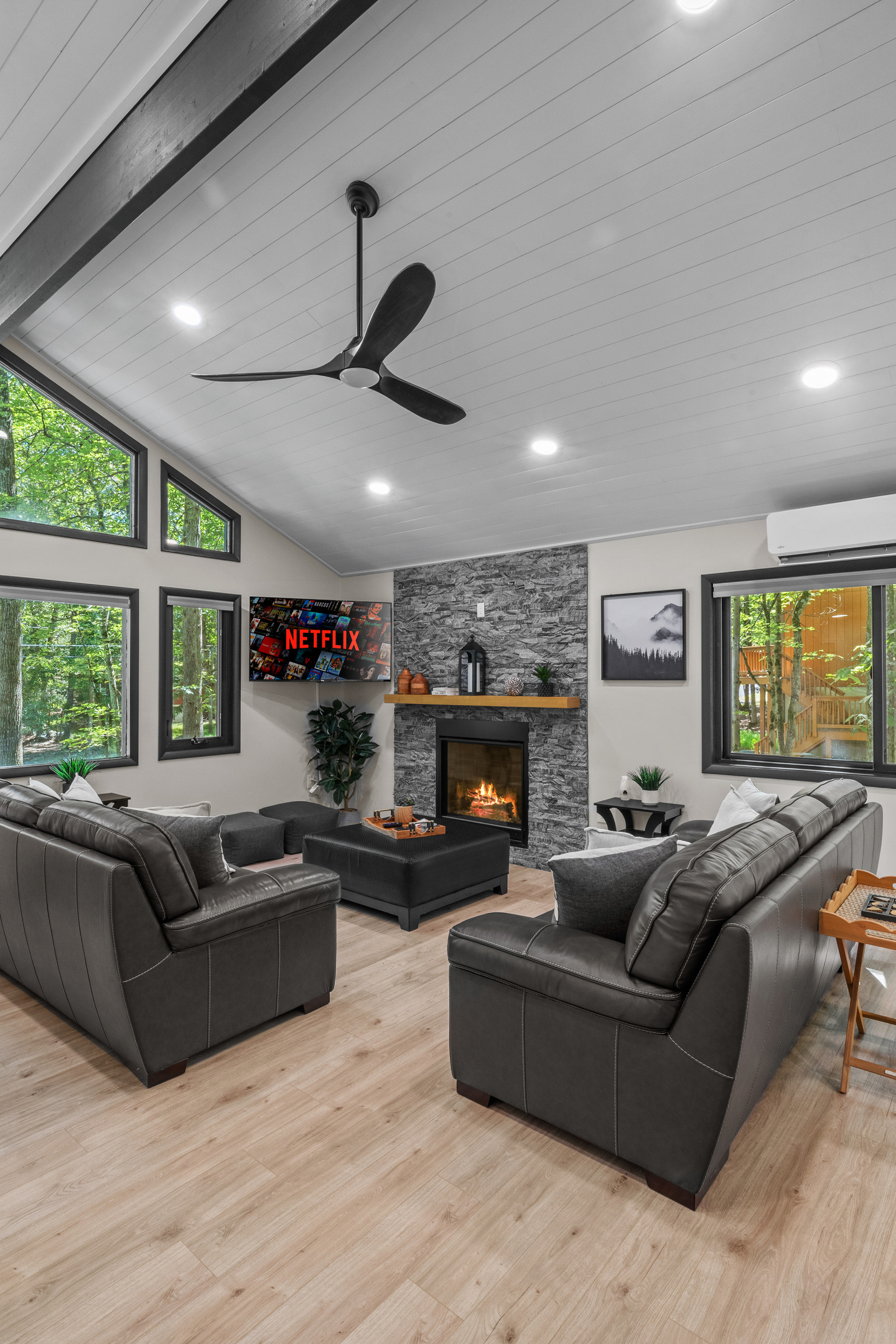 Step into the family room to relax, unplug, and soak in the quiet nature views from the large windows
