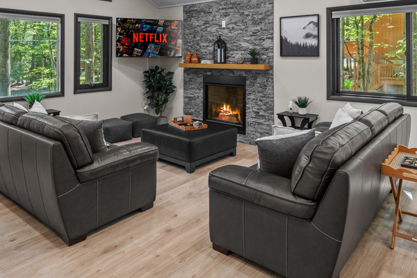 Step into the family room to relax, unplug, and soak in the quiet nature views from the large windows
