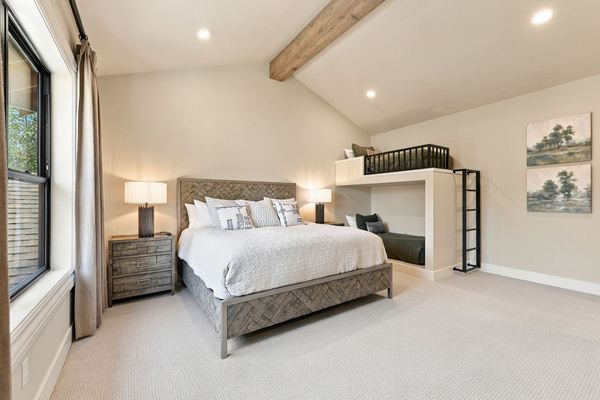 King suite #4 with blackout window coverings, TV and private ensuite bath - and a set of twin bunk beds! (upstairs)