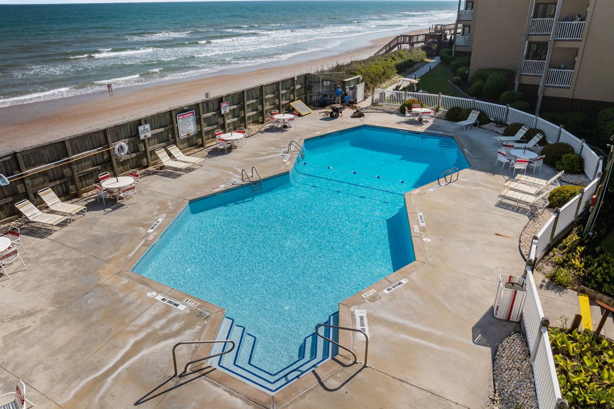 Cool off in the oceanfront community pool just steps from the sand

