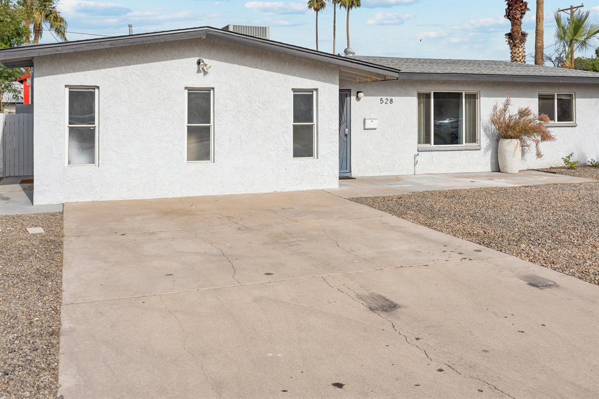 The studio entrance is located on the left side of the home