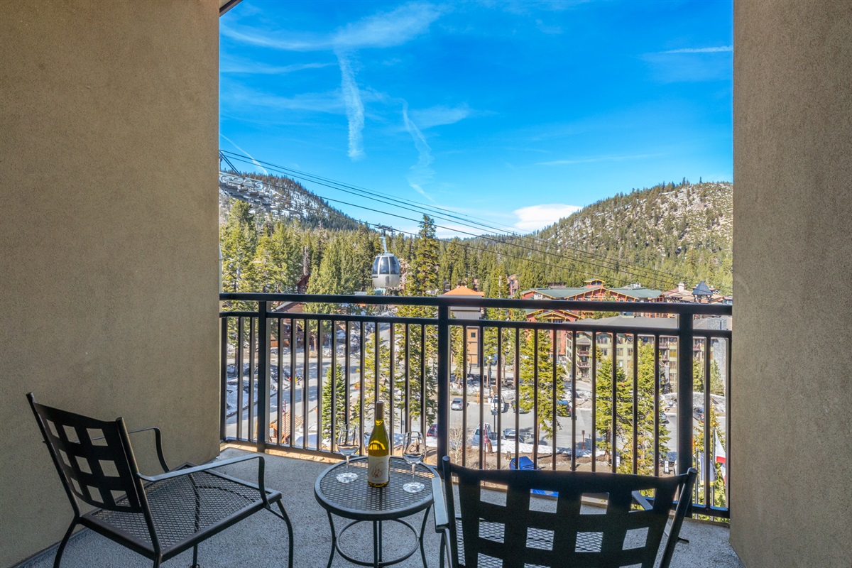 The guest bedroom features its own private balcony, creating a separate outdoor space with a connection to the energy of the Village below.