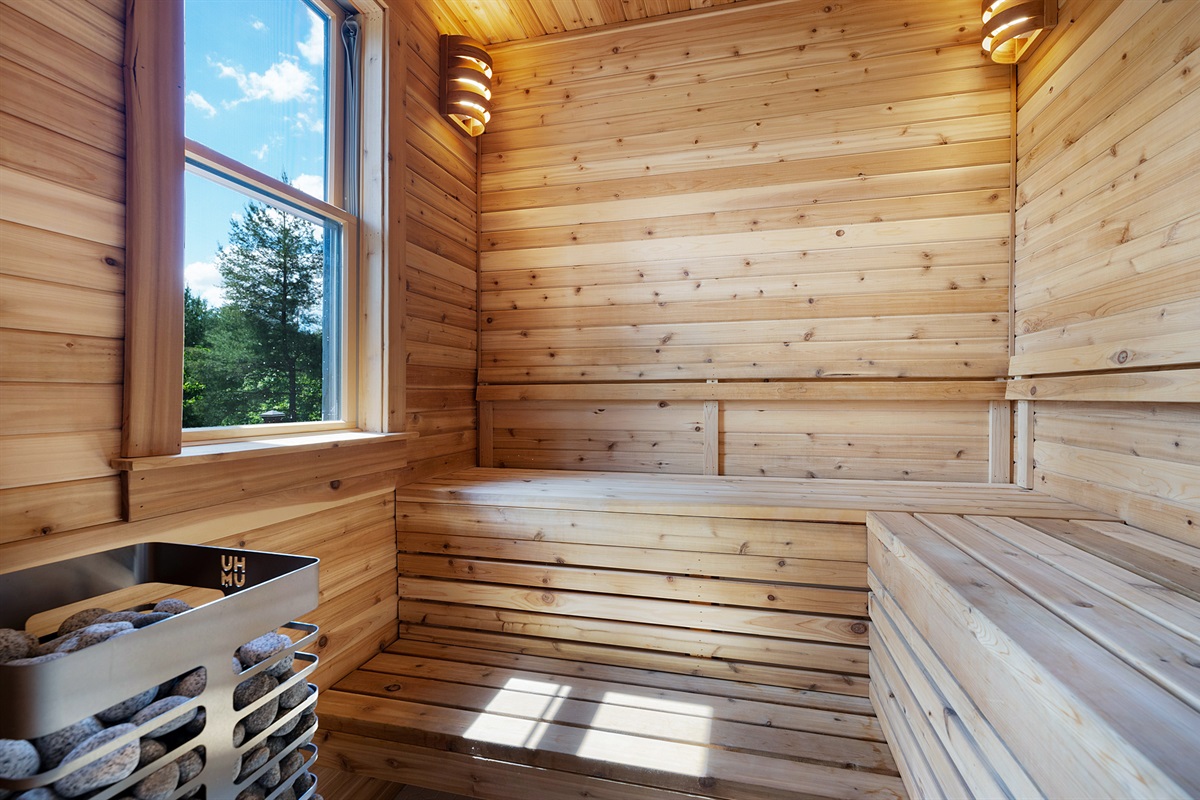 Enjoy a warm, relaxing session in this cedar sauna, perfect after a day of exploring the mountains.