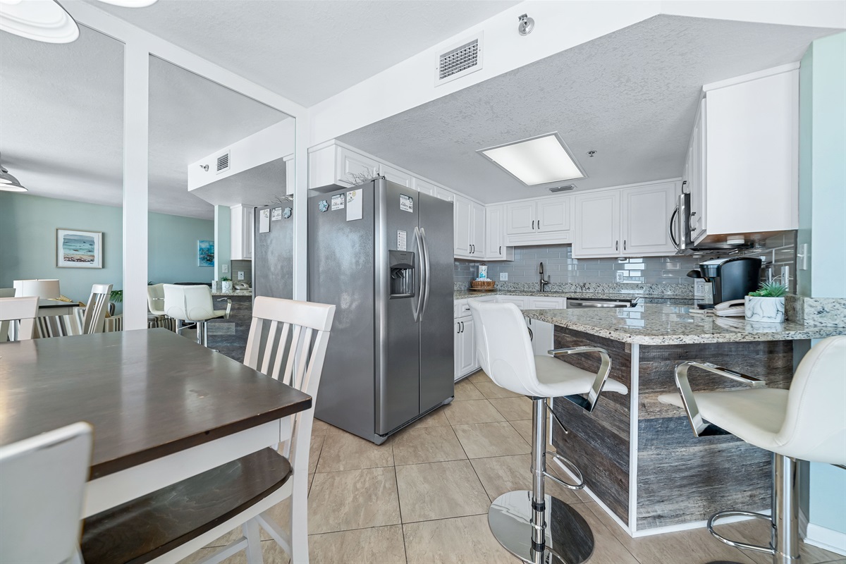 Enjoy a seamless flow from the well-appointed kitchen with breakfast bar seating for 2, to the dining and living areas. Fully equipped with modern appliances, this kitchen ensures you never miss a moment of that breathtaking beachfront scenery.