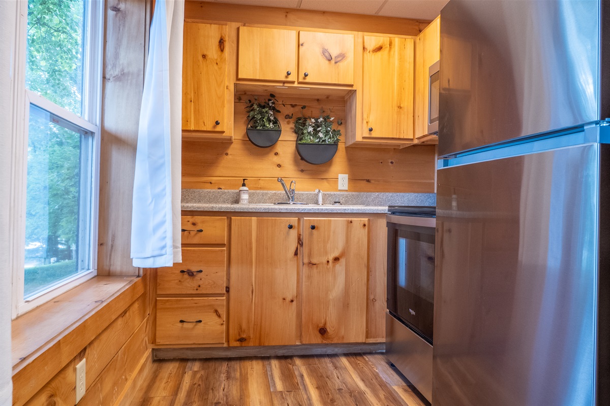 Bonus! This cabin truly offers it all, including a convenient second kitchen on the lower level making it perfect for larger groups, extra snack prep, or easy access for outdoor meals at the oversize picnic table (seating 8!).