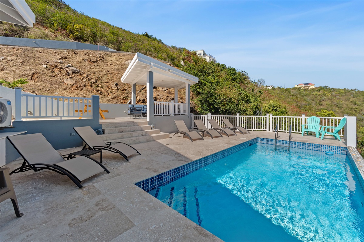 Enjoy endless ocean views from the pool deck with sun loungers.